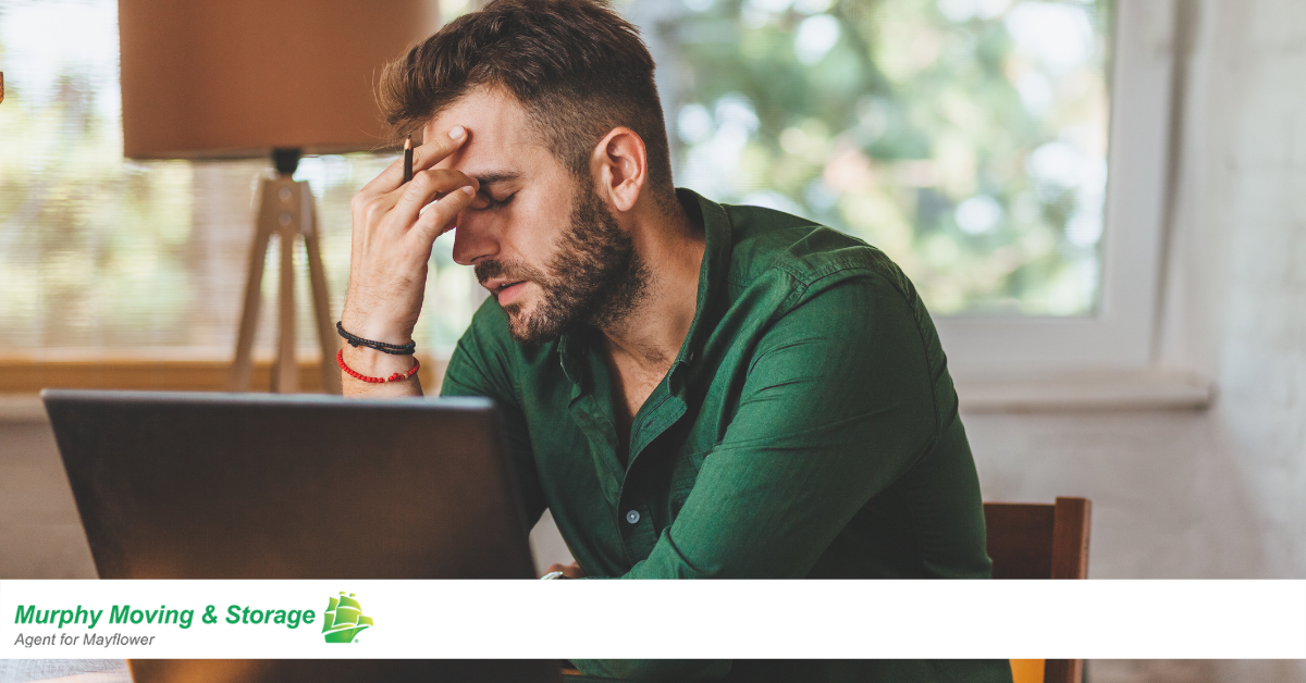 man with hand on head in stressed state