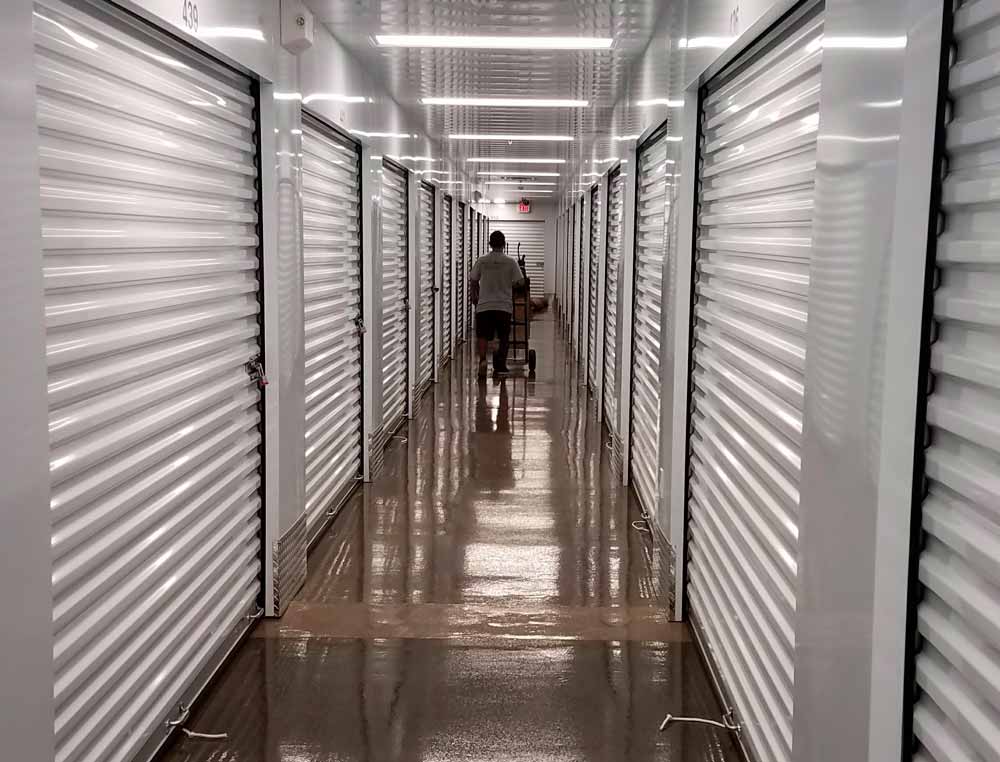 guy walking across storage rooms