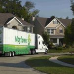 moving truck passing neighborhood