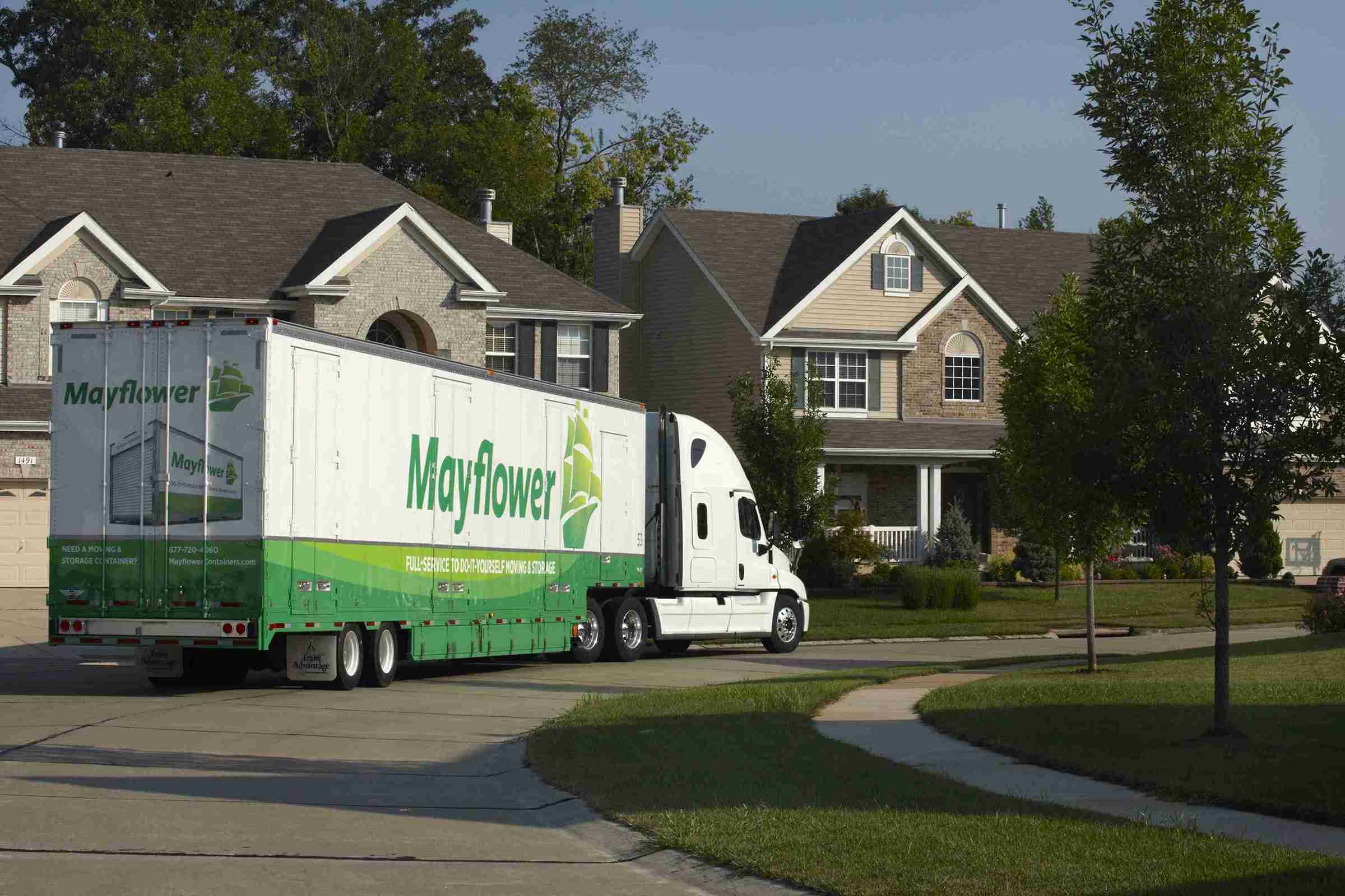 moving truck passing neighborhood