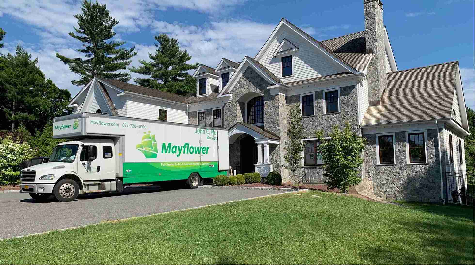 moving truck parked out side of the house