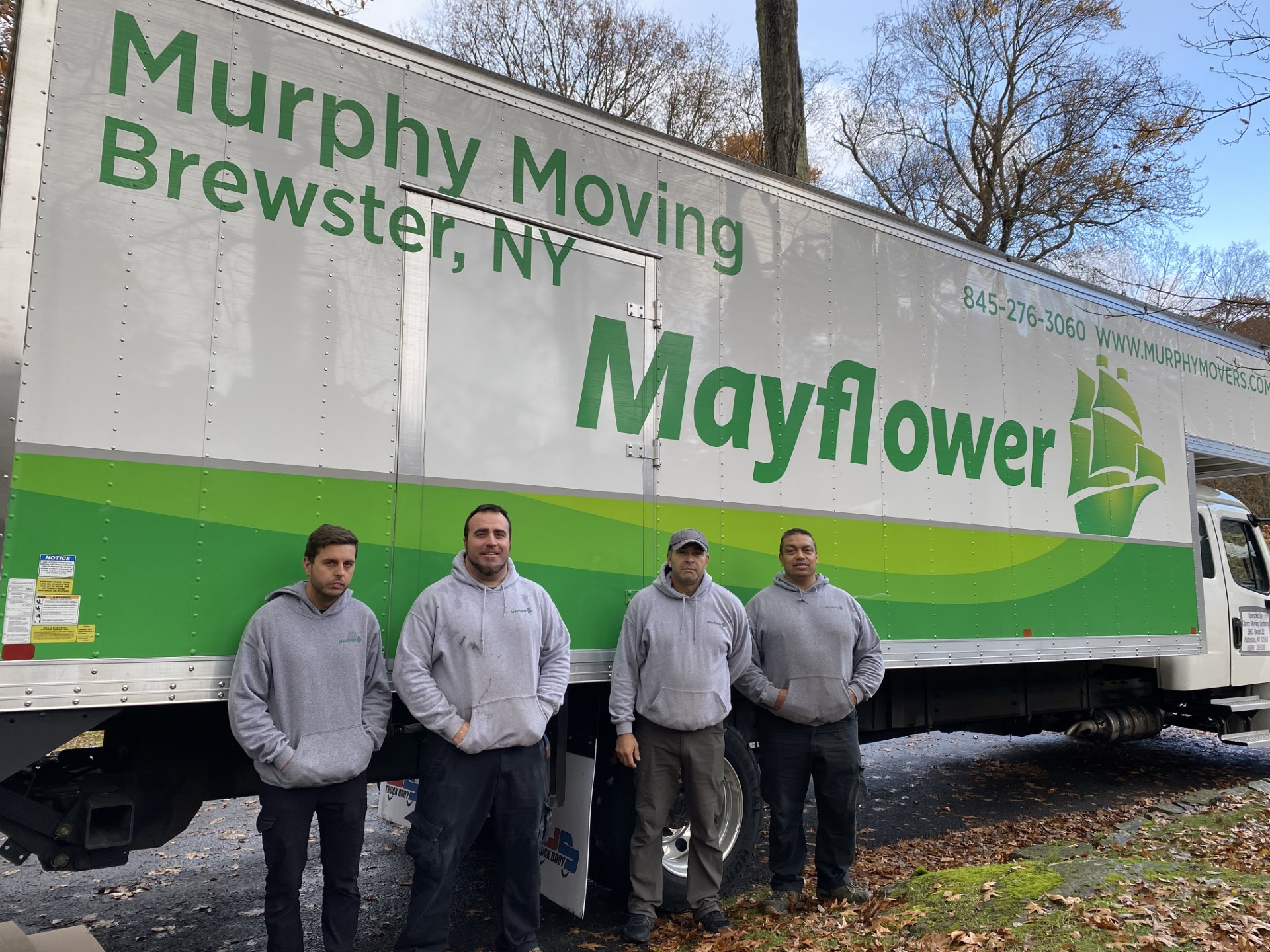 men standing in front of a truck