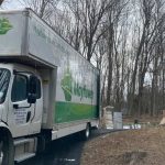 A Mayflower truck parked outside a house for a move in Hartford.