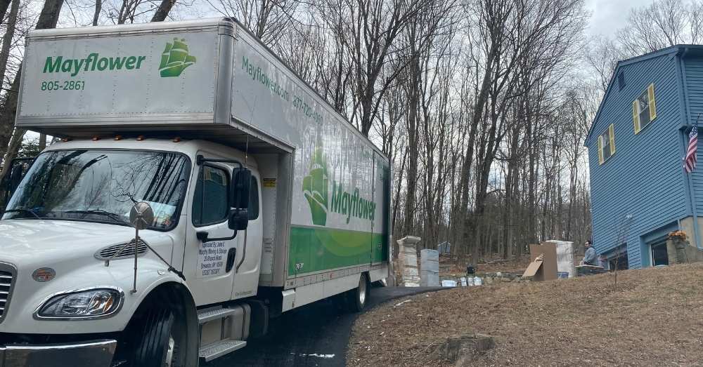 A Mayflower truck parked outside a house for a move in Hartford.