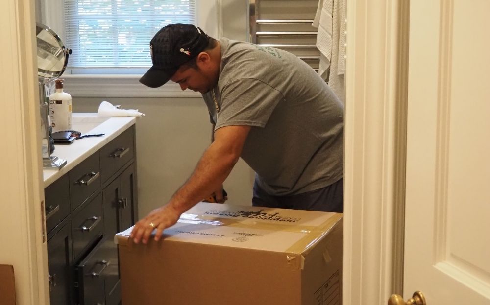 person wrapping the box
