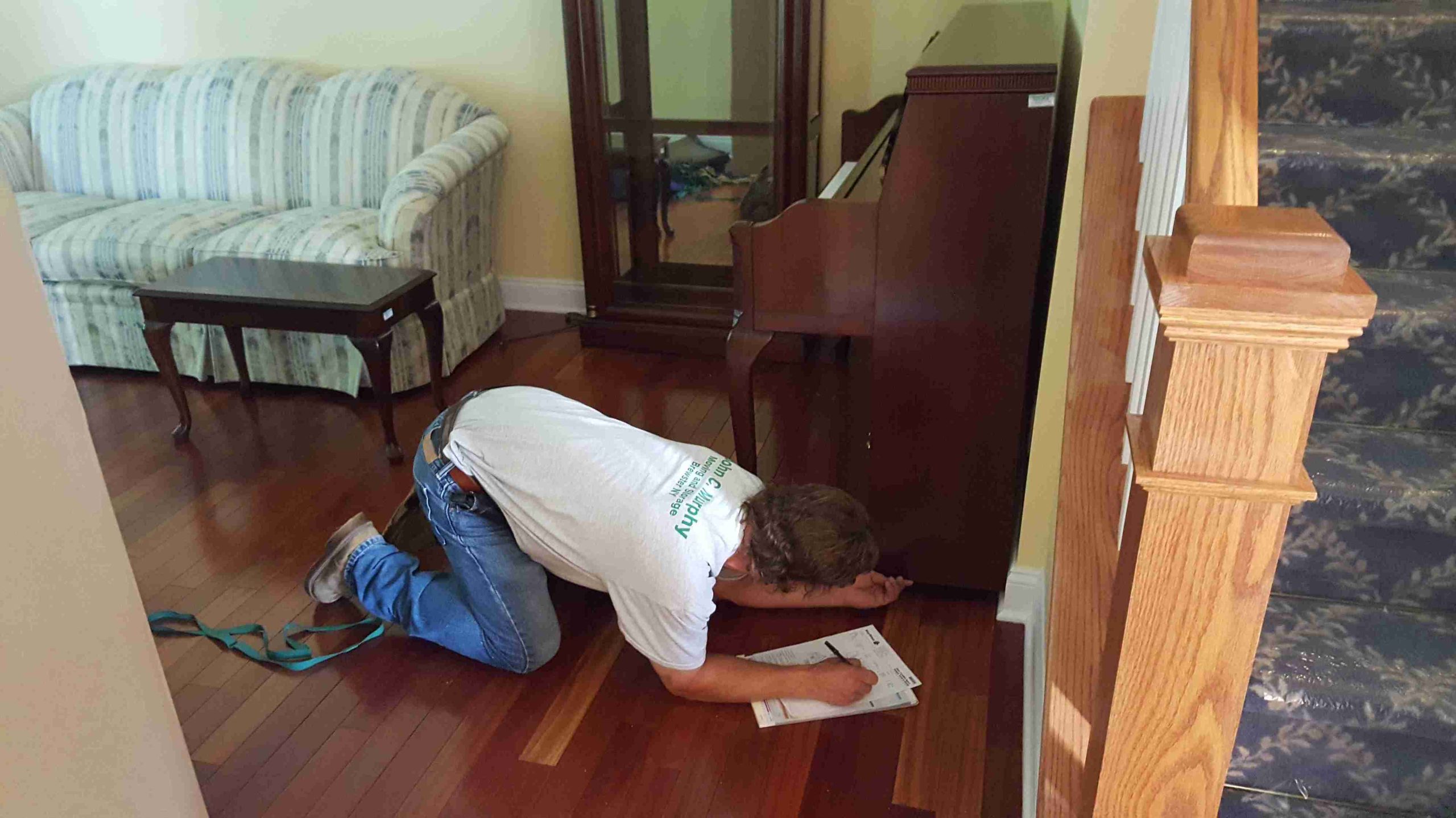 worker listing the details of the package