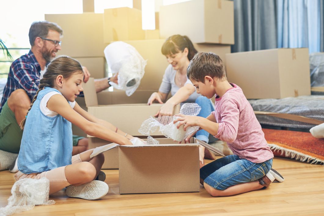 Home family packing boxes moving property relocation rent help children parents cardboard package