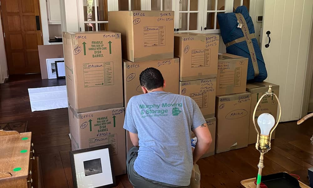 Mover checking label on boxes
