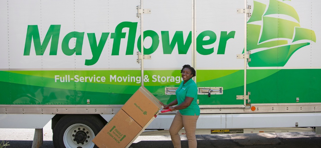 professional mover wearing a green polo shirt