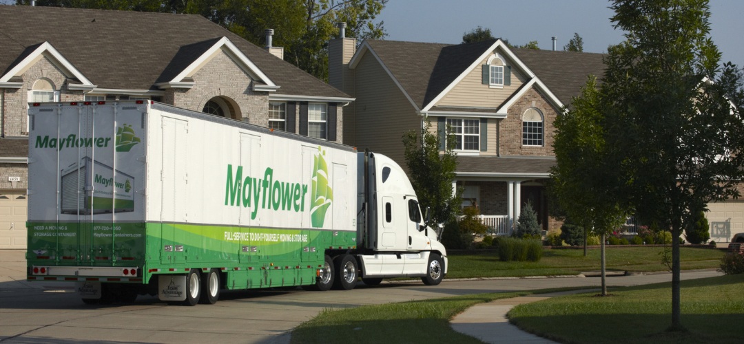 A large white Mayflower moving truck