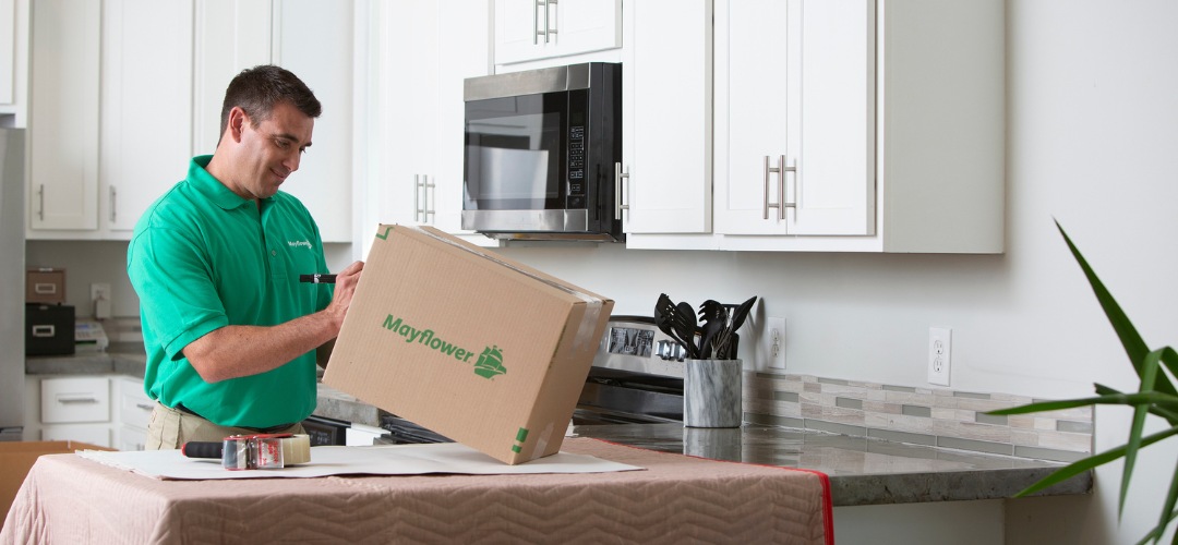 mover writing on a cardboard box