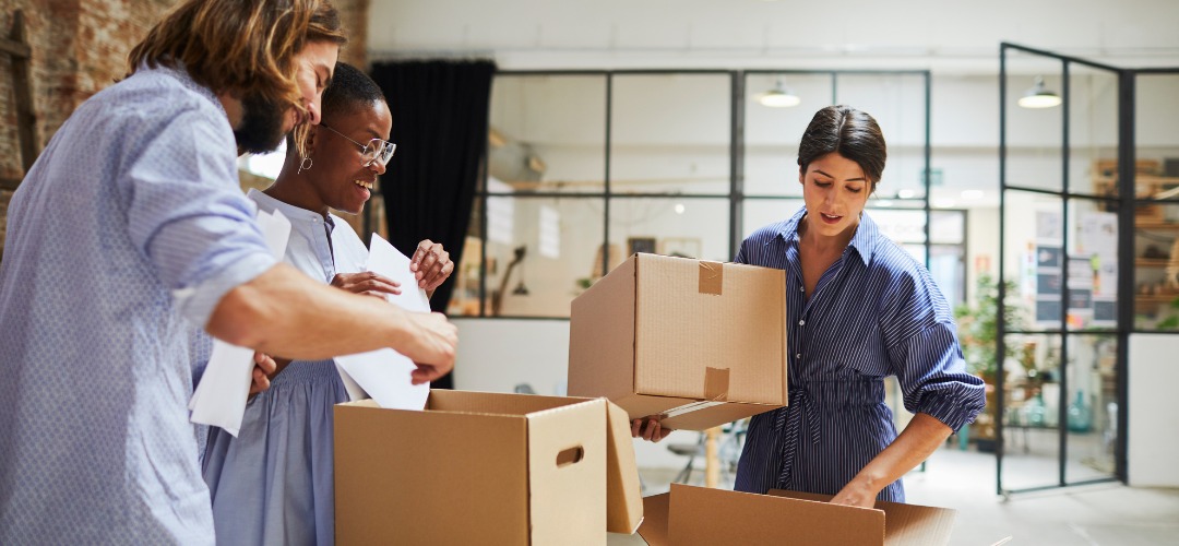 people packing and unpacking cardboard boxes