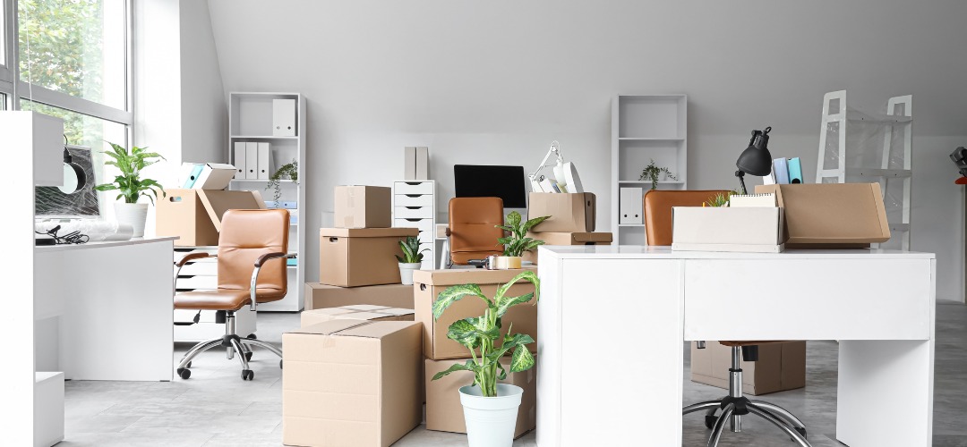 office filled cardboard moving boxes